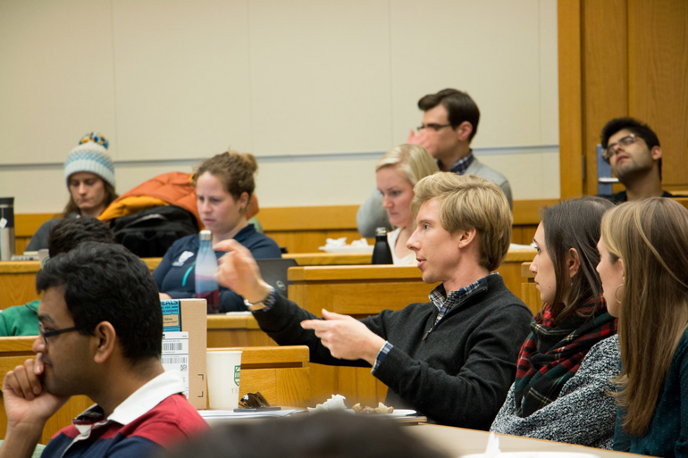 Tuck students hear a lecture offered by classmates in the energy industry